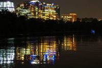 River water reflecting city lights at night