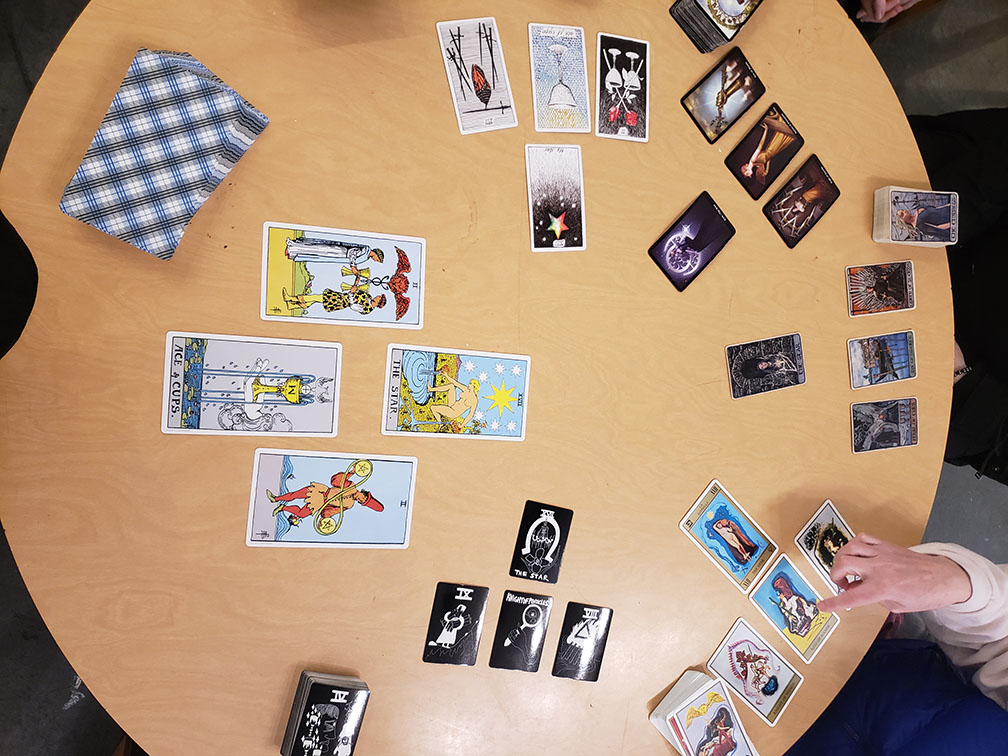 Tarot cards arranged on a table. Photo by Melissa Richards.